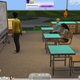 A Sim looks at their phone during class.